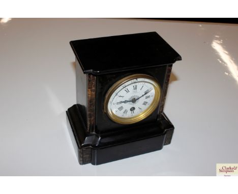 A late Victorian black slate mantle clock by Tree of London