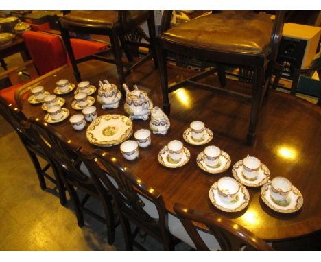Victorian Rockingham Style Porcelain Tea and Coffee Service Gilded and Painted with Scenes 