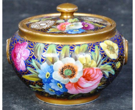 Spode early 19th century compressed globular pot with lid in heavily painted floral sprays to gilded cobalt ground. Stamped 1