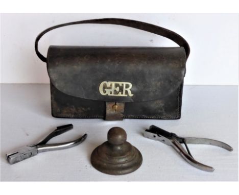 A Lot containing a Midland Railway style paperweight. LMS ticket nippers. Unmarked ticket nippers and a GER leather detonator