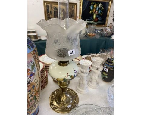 A Victorian oil lamp, hand painted font with original Victorian shade, good condition, only slight chip at top of chimney