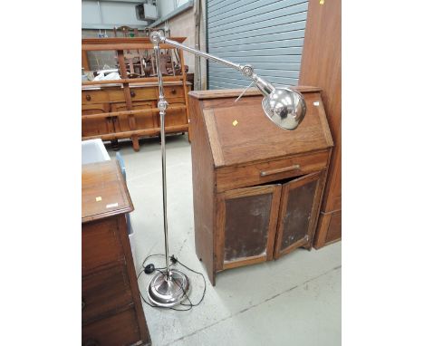 A modern chrome angle poise standard lamp 
