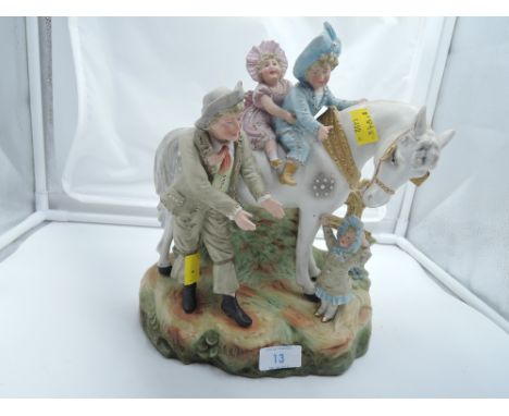 A bisque figure of children and horse