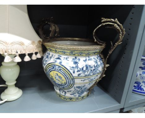 A large twin handle planter with blue and yellow decoration