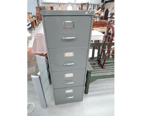 A vintage metal 4 drawer filing cabinet