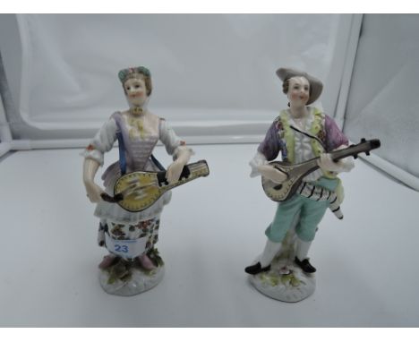 A pair of ceramic figures of musicians bearing red Chelsea anchor mark to base