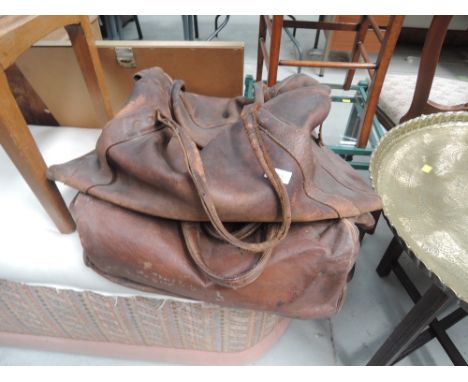 Two vintage gladstone bags, with travel labels 