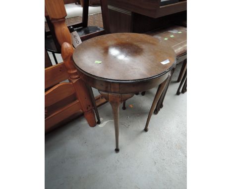 An early 20th Century mahogany occasional table on cabriole legs