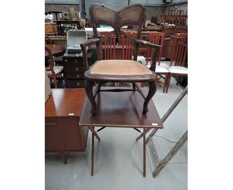 A leather topped card table and chair