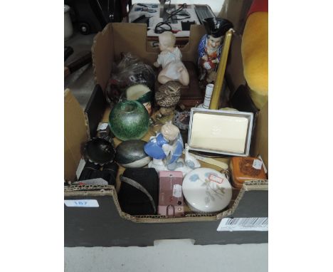 A selection of curios including Piano baby and arts and craft candle stick