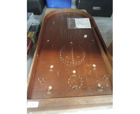 A wooden Bagatelle board game