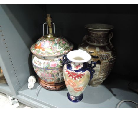 A hand decorated famille rose Chinese lamp base and similar ceramics