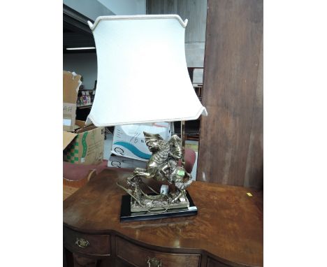 A modern table lamp in the classical style having Napoleon sculpture base