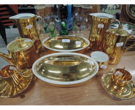 A selection of gold glaze ceramics including Crown Devon and Worcester