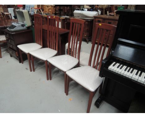 A mahogany effect dining table with integral cupboard and chair set