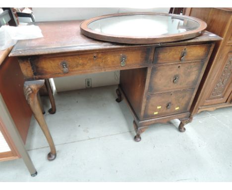 A mid 20th Century walnut desk/dressing table