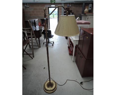 A heavy set brass standard lamp