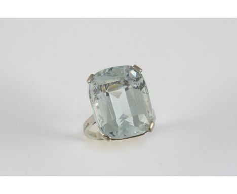 AN AQUAMARINE SINGLE STONE RING set with a step-cut aquamarine. Size K.