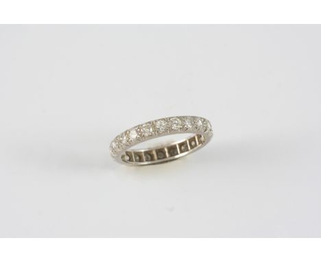 A DIAMOND FULL CIRCLE ETERNITY RING set with circular-cut diamonds. Size K 1/2.