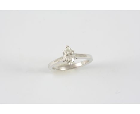 A DIAMOND SOLITAIRE RING the marquise-cut diamond is set in 18ct. white gold. Size K.