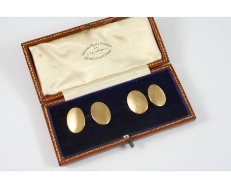 A PAIR OF 18CT. GOLD CUFFLINKS of oval, plain form, 12.4 grams.