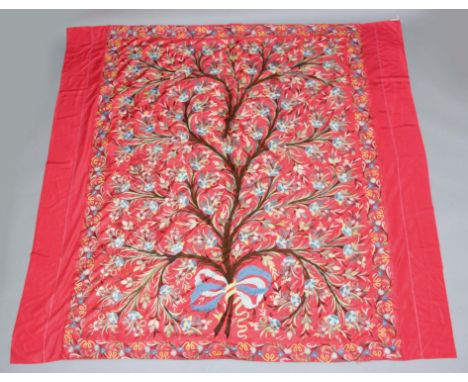 SILK BED SPREAD, probably Middle Eastern, worked with a Tree of Life design on a red ground, 210cm x 210cm approx