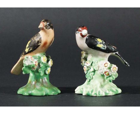 DERBY GOLDFINCH AND BULLFINCH, late 18th or early 19th century, on flower encrusted stumps, patch marks, height 7cm and small
