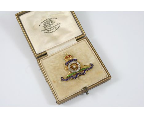 A DIAMOND AND ENAMEL REGIMENTAL BROOCH FOR THE ROYAL ARTILLERY set with rose-cut diamonds and green, red and blue enamel deco