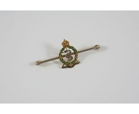 A DIAMOND, ENAMEL AND 18CT. GOLD BROOCH FOR THE ROYAL ARMY MEDICAL CORPS. set with rose-cut diamonds and green, red and blue 