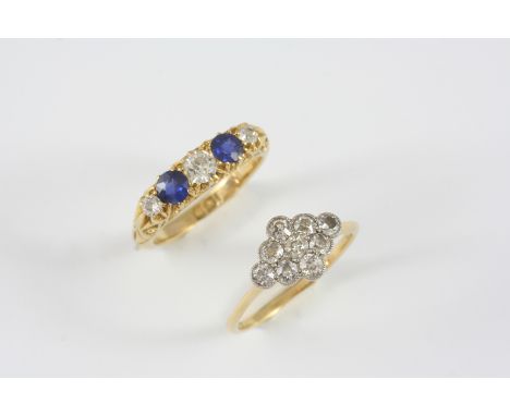 A SAPPHIRE AND DIAMOND FIVE STONE RING the two circular-cut sapphires are set with three circular-cut diamonds in 18ct. gold,