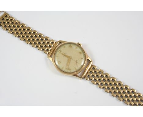 A GENTLEMAN'S 9CT. GOLD WRISTWATCH BY OMEGA the signed circular dial with alternate Arabic and dagger numerals, with presenta