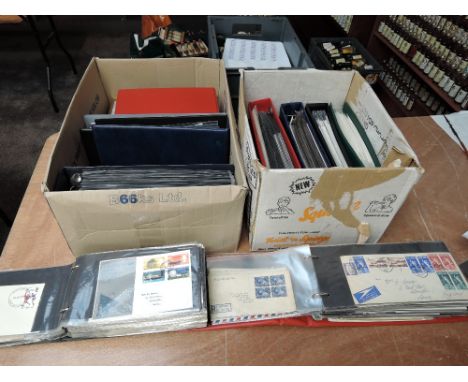 Two boxes of GB, Commonwealth and World First Day Covers and Commemorative Covers in 10 albums and in tin, some early example