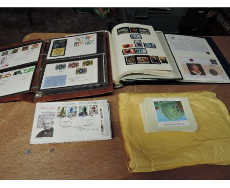 An album of GB  Queen Elizabeth II stamps, an album containing three Coin Covers, an album and loose First Day Covers, 1970's