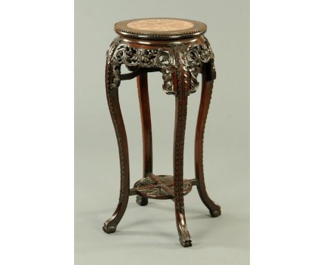 A 19th century Chinese hardwood jardiniere stand, large form, with rouge marble top and low shelf.  Diameter 40 cm, height 92