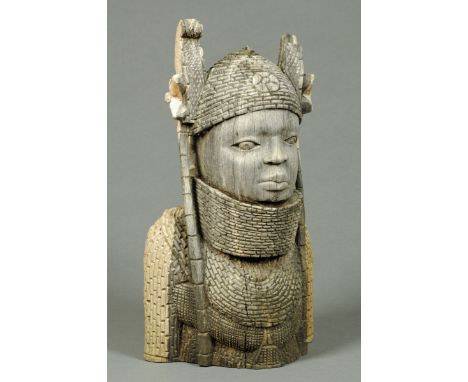 An African carved wooden bust.  Height 38 cm. 