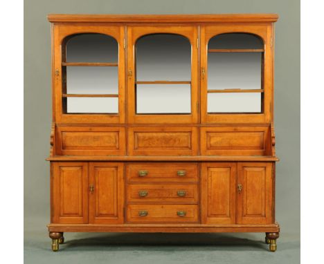 A Victorian walnut chemists cabinet, with series of glazed cupboards, fall front cabinets enclosing pigeonholes and drawers a