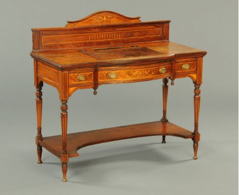 An Edwardian inlaid rosewood desk by Shoolbred, with rear upstand, tooled leather writing surface, series of frieze drawers a