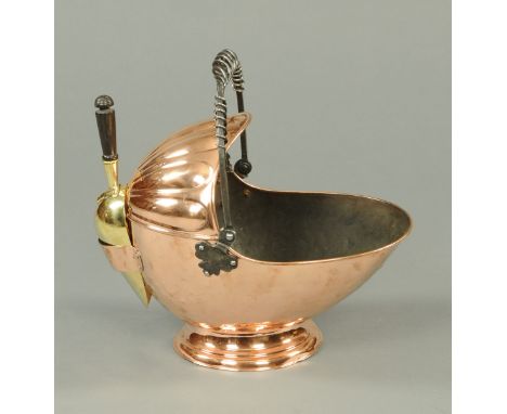 A 19th century copper coal helmet, with loop handle and brass shovel (see illustration).  