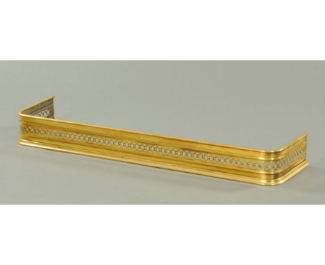 A 19th century brass fender, with pierced front and sides.  Internal dimension 130 cm.  