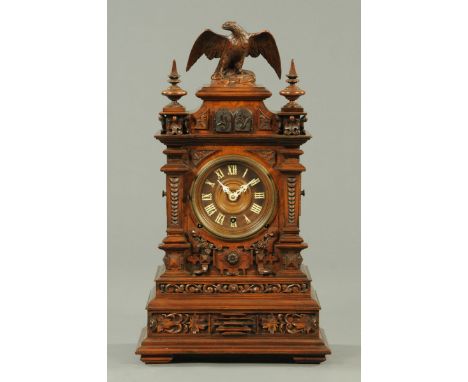 A 19th century Black Forest walnut bracket clock, with three-train fusee movement on wooden seatboard, with cuckoo and quail 