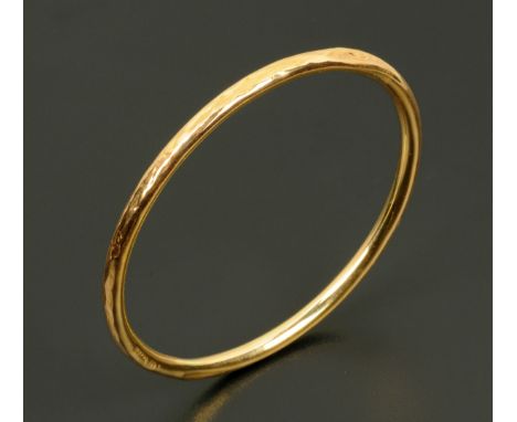 A 9 ct gold pectoral bangle, hallmarked.  Internal diameter 75 mm, 6.8 grams.  