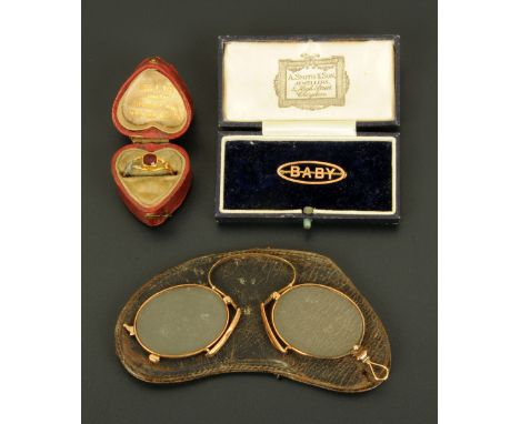 A single stone ruby ring, set on a yellow gold shank (AF), a pair of Victorian pince nez and a yellow gold baby brooch.  