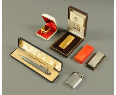 Two Dunhill cigarette lighters, a Ronson Penciliter, an Ippag Dice lighter and another.  