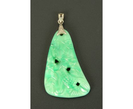 A carved and pierced jade pendant.  Height 45 mm.  