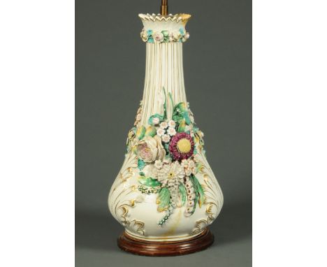 A large Continental porcelain floral encrusted lamp base.  Height excluding light fitting 49 cm. 