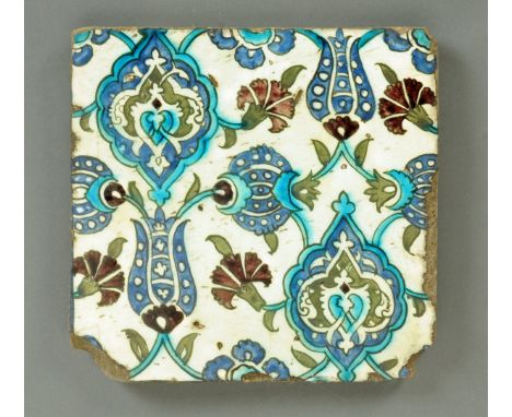 * An Ottoman tile, Damascus, probably late 16th century, decorated with tulip heads, carnation heads, palmettes and arabesque
