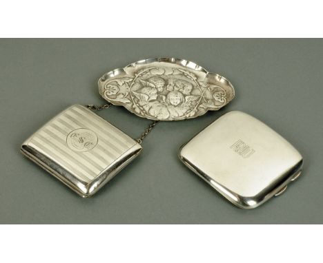 A silver cigarette case, Birmingham 1912, a silver pin tray stamped with cherubs heads, London 1898, and a silver engine turn