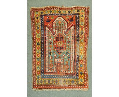 * A North East Turkey Caucasian rug, with rectangular centre panel with turquoise ground and repeating designs and with multi