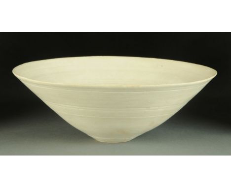 * Lucie Rie (1902-1995), a white porcelain bowl, circular, impressed "LR" monogram within foot.  Diameter 28.5 cm, height 10.