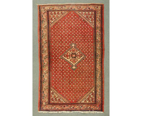 * A Ferahan rug, with centre diamond and repeating motif to the rectangular panel with multiple line border.  130 cm x 205 cm